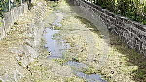 Soultz-Haut-Rhin, France - October 10 2023: Dwindling Waters: The Rimbach Streambed of Soultz-Haut-Rhin in Alsace's Embrace