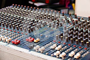 Sound and audio mixer control panel with buttons and sliders