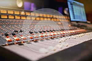 Sound board, music and production in recording studio with creativity and audio equipment. Mixing console with buttons