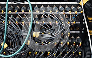 Sound control panel. Large quantities of XLR connectors and wires.