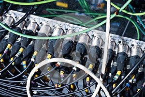 Sound control panel. Large quantities of XLR connectors and wires.