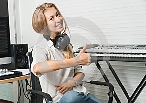 Sound engineer woman headphone editor control audio mixing panel studio recording
