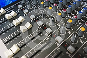 Sound equipment for a nightclub, discotheque or recording studio. The mixing console of the sound engineer in operation.