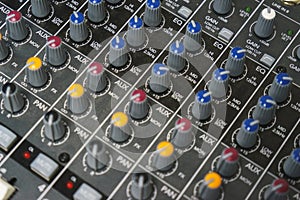 Sound equipment for a nightclub, discotheque or recording studio. The mixing console of the sound engineer in operation.