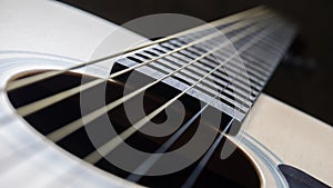 Sound hole and strings of acoustic guitar