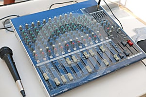 Sound levels on a professional audio mixer with microphone, Music control panel