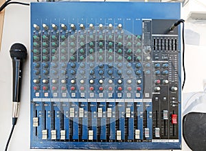 Sound levels on a professional audio mixer with microphone, Music control panel