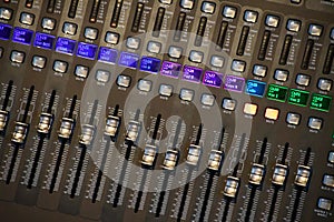 Sound mixer board with illuminated buttons