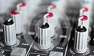 Sound mixer and faders close up music studio