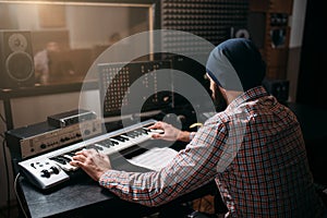 Sound producer work with audio equipment in studio