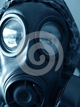 Sound the sirens. Closeup shot of a man in a gasmask.