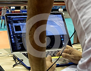 Sound studio adjusting record equipment.