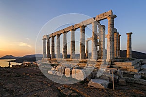 Sounion, Attica / Greece: Colorful sunset at Cape Sounion and the ruins of the temple of Poseidon