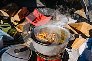 Soup Boiling on burner, cooking food outdoor on gas jet
