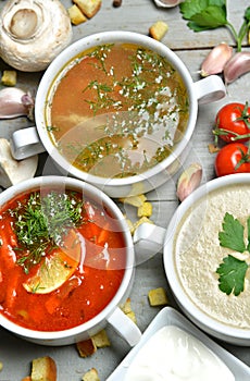 soup bowls mashroom cream soup fish and tomato in bowl with croutons