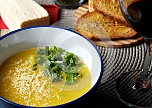 Soup with bread, wine and cheese