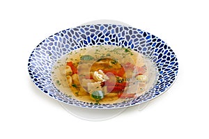 Soup consomme with vermicelli and vegetables. On a white background. Isolated