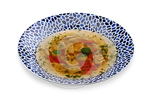 Soup consomme with vermicelli and vegetables. On a white background. Isolated