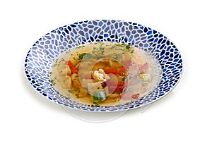 Soup consomme with vermicelli and vegetables. On a white background. Isolated