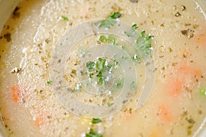 Soup with croutons on the wooden table