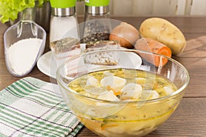 Soup with dumplings and ham