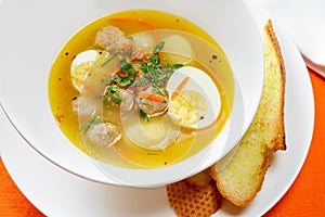 Soup with eggs and meatballs