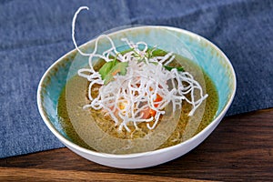 Soup Fo Bo from smoked catfish with cellophane noodles. The work of a professional chef. Dish from a restaurant or cafe menu.