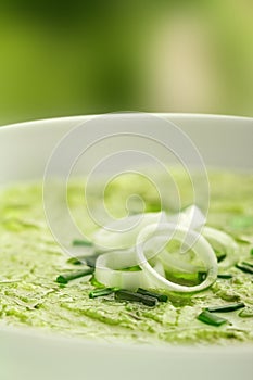 Soup garnished with onion rings