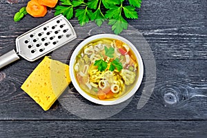 Soup Minestrone in bowl on black board top