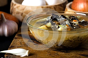 Soup mushrooms glass bowl wooden spoon