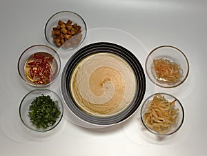 Soup in a plate close-up on a light background