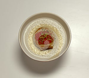 Soup in a plate close-up on a light background