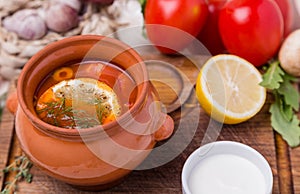 Soup saltwort with garnish in brown ceramic pot