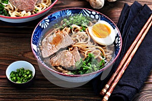 Soup with soba noodles, beef, ginger, green onions and egg.