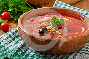 Soup solyanka Russian with meat, olives and gherkins