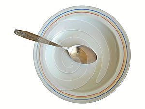 Soup Spoon in Plate Isolated