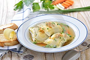 Soup with stuffed ravioli