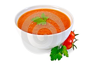 Soup tomato in white bowl with parsley