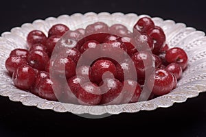 Sour cherry on a silver plate