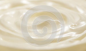 Sour cream or greek yogurt swirl texture, White cream background, close up. Dairy product