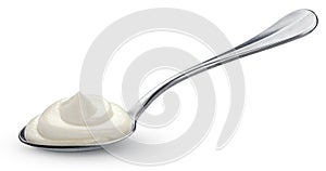 Sour cream in spoon on white background