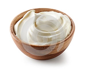 Sour cream yogurt in wooden bowl photo