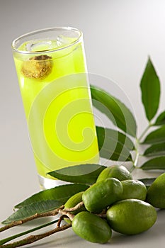 Sour plum juice with ambarella fruit photo