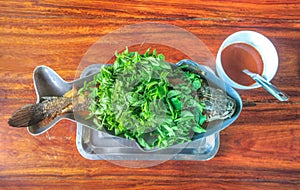 Sour soup with fried snake-head fish and vegetable. Kang Som is