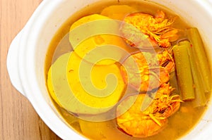 Sour and spicy shrimps curry with bamboo shoot and lotus stem