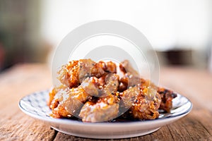 Sour-sweet baked chicken wings sesame and  teriyaki sauce