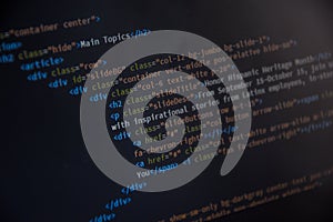 Close up css HTML code on monitor screen with black background