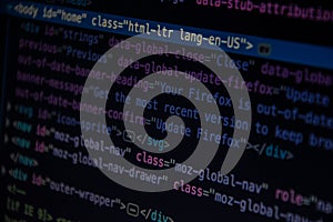 Close up css HTML code on monitor screen with black background