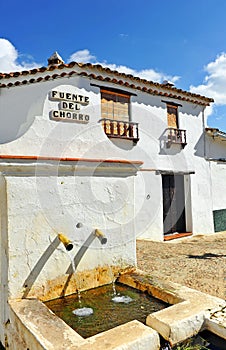 Source of the jet -Fuente del Chorro- drinking water in Castano del Robledo, province of Huelva, Spain photo