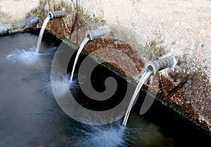 Source of three pipes with crystal clear water
